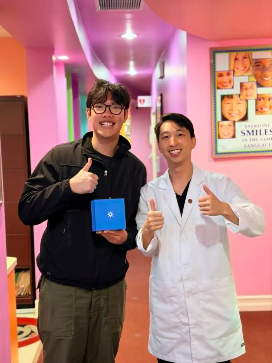Dr. Luke Wu talking with a patient at Agape Dental